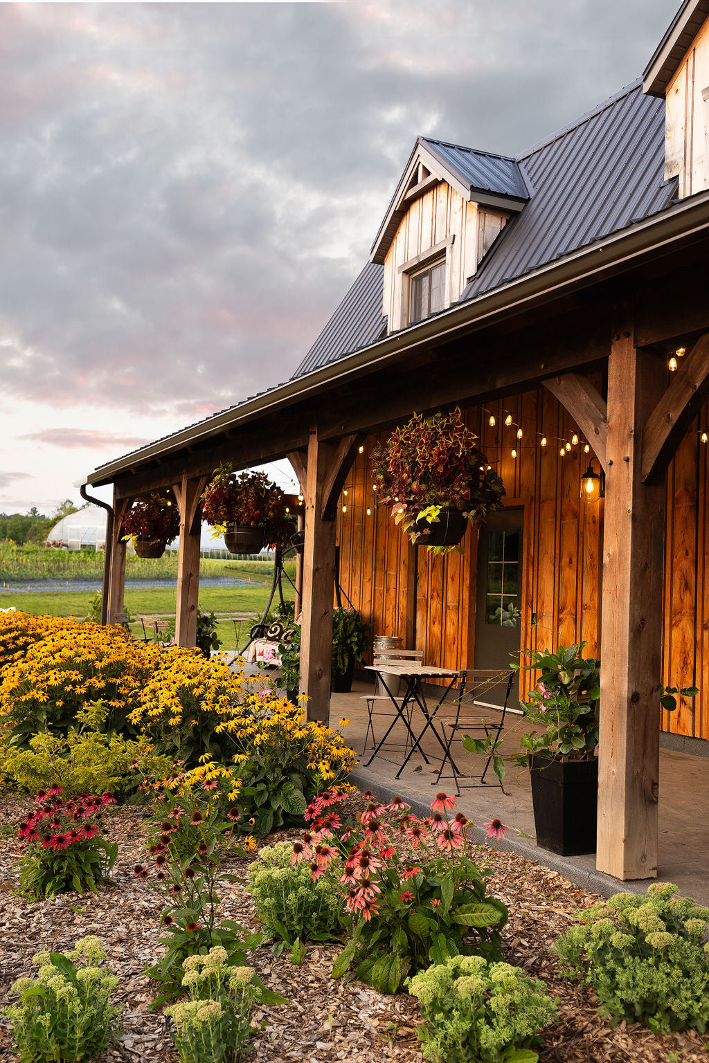 Side angle shot showin front veranda on barn.