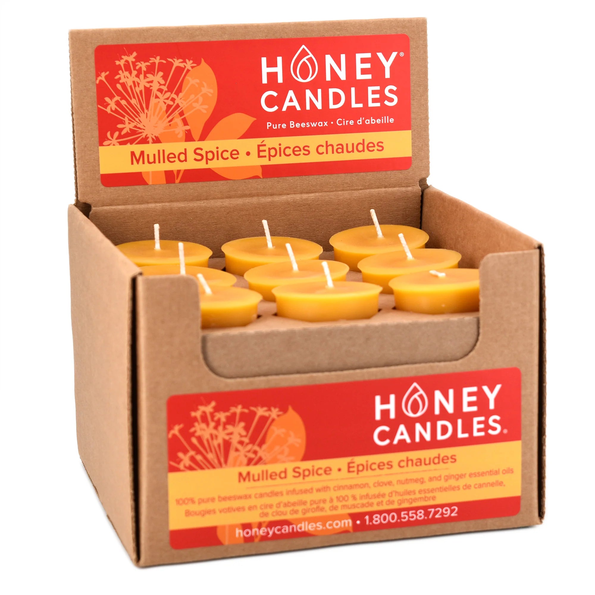 Box of Honey Candles in Mulled Spice scent with visible candles inside.
